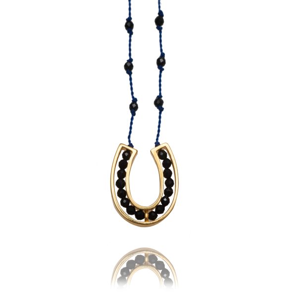 828-yellow gold-horseshoe-spinel-blue cord-75